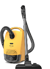 Hochkant aufgestellter gelber Staubsauger.