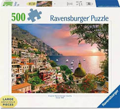 Produktabbildung einer Ravensburger‑Puzzle‑Schachtel (500 Teile). Auf der Vorderseite ist ein stimmungsvolles K stenmotiv bei Sonnenuntergang abgebildet: Rechts glitzert das Meer in warmen Orange‑ und Rosat nen, mehrere kleine Segelboote sind auf dem Wasser zu sehen. Links steigt eine malerische italienisch wirkende K stenstadt terrassenf rmig den Hang hinauf; zahlreiche bunte H user mit roten und ockerfarbenen D chern, Balkonen und Pflanzen schmiegen sich an den steilen Hang. Unten rechts im Bild ein gelbgr nes Kuppeldach einer Kirche, davor bl hende K belpflanzen und ein Gel nder mit Blick aufs Meer. Oben rechts ragt ein Baum mit Zweigen ins Bild, die Szene wirkt warm, idyllisch und mediterran. Auf der Schachtel sind oben links die Zahl „500“ und ein Puzzlesymbol sowie der Markenname „Ravensburger Puzzle“ aufgedruckt. 