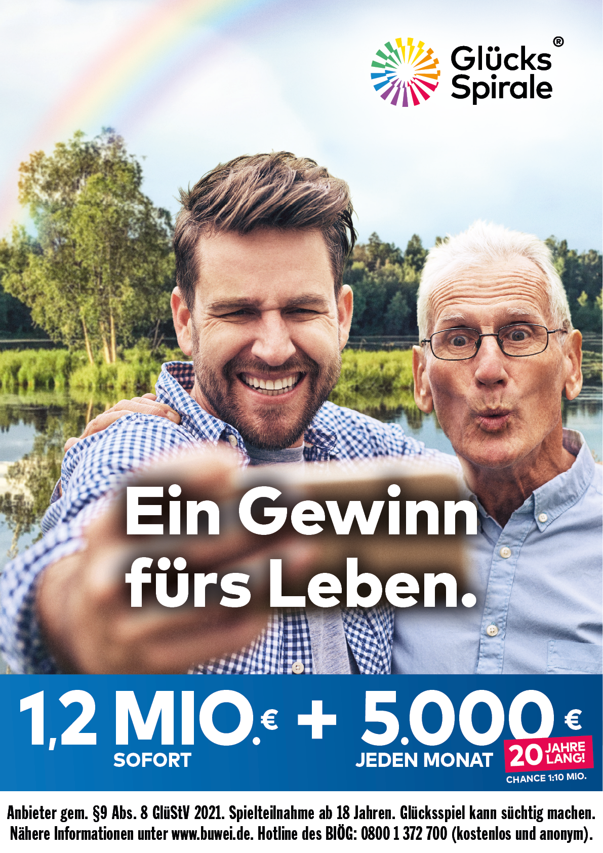 Zwei fr hliche Personen posieren vor einer Seenlandschaft mit B umen und einem Regenbogen im Hintergrund, w hrend sie auf die Kamera zeigen, begleitet von einem Werbetext f r eine Gewinnchance im Leben. Beschreibung von KI generiert
