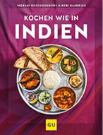 Ein Kochbuchcover mit dem Titel „Kochen wie in Indien“ zeigt einen traditionellen indischen Thali-Teller mit verschiedenen Currys, Reis, Chapati und Beilagen auf einem purpurroten Hintergrund. Beschreibung von KI generiert